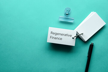 There is word card with the word Regenerative Finance. It is as an eye-catching image.