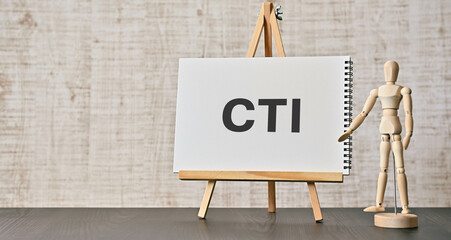 There is notebook with the word CTI. It is an abbreviation for Computer Telephony Integration as eye-catching image.