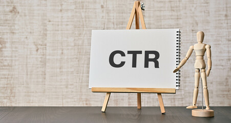 There is notebook with the word CTR. It is an abbreviation for Click Through Rate as eye-catching image. - obrazy, fototapety, plakaty