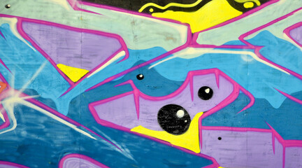 Colorful background of graffiti painting artwork with bright aerosol outlines on wall. Old school...