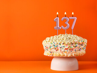 Candle number 137 - Vanilla cake in orange background