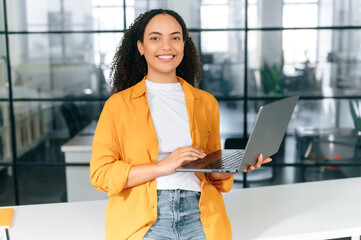 Beautiful brazilian or latino young professional business woman corporate marketing manager,...