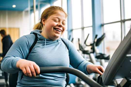 A woman with Down syndrome enjoys a exercise routine on a cardio machine at a well-equipped gym, delight of active living. Concept of inclusivity in fitness and sports for people with disabilities
