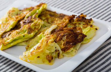 Cabbage leaves in batter is tasty vegan dish in the kitchen.