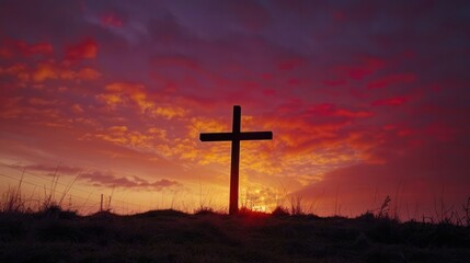 Silhouette of Cross with Background of Warm Sunrise