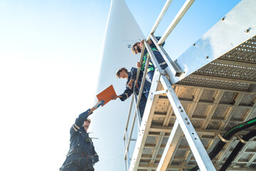 engineer working in fieldwork outdoor. Technicians of wind turbine checking and maintenance...