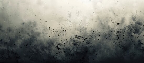 Obraz premium A black and white image capturing fluffy clouds floating in the sky, creating a stark contrast against the dark backdrop. The clouds appear soft and billowy, with varying shapes and sizes.