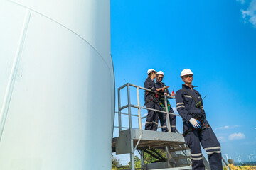 engineer working in fieldwork outdoor. Technicians of wind turbine checking and maintenance Electricity wind generator.. operation of wind turbines that converts wind energy into electrical energy