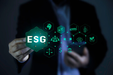 Businessman pointing to ESG icon. Net zero emission Idea innovation. Environmental,...