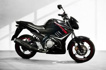 Fototapeta na wymiar black sports type motorbike with fuel injection system