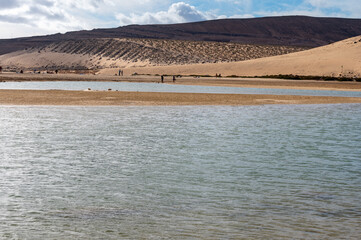 View on sandy dunes and turquoise water of Sotavento beach, Costa Calma, Fuerteventura, Canary islands, Spain in winter