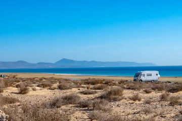 Foto auf Acrylglas Strand Sotavento, Fuerteventura, Kanarische Inseln Sandy dunes and turquoise water of Sotavento beach, Costa Calma, Fuerteventura, Canary islands, Spain in winter, camper car vacation