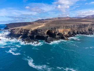 Crédence de cuisine en verre imprimé les îles Canaries West coast of Fuerteventura island. View on blue water and black caves of Ajuy village, Canary islands, Spain.
