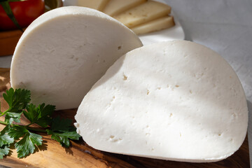 Freshly strained white soft goat cow sheep milk cheese, young Spanish cheese