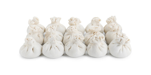 Many uncooked khinkali (dumplings) isolated on white. Georgian cuisine