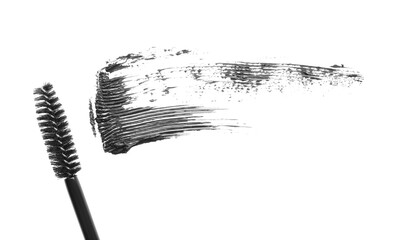 Smear of mascara and applicator isolated on white, top view