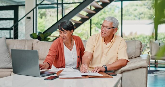 Senior couple, laptop and taxes in home with talking, reading and writing for finance, budget or investment. People, old woman and elderly man by computer, retirement income or paperwork for savings