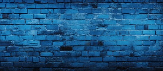 A dark blue brick wall with a grungy effect, showing signs of wear and tear with a rough texture...
