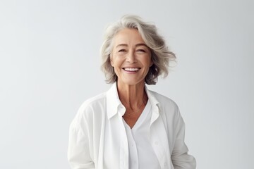 Portrait of smiling senior woman with grey hair, isolated on white background - obrazy, fototapety, plakaty