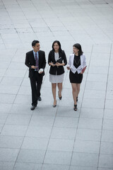 Elevated view of 3 Asian Business people.