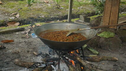 cooking rendang, Indonesia's iconic and flavorful dish