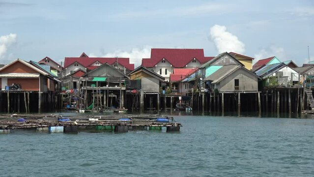 Footage of stilt houses also called pile or lake dwellings are homes raised on stilts or piles over the surface of a body of water and are built primarily as a protection against flooding 4k