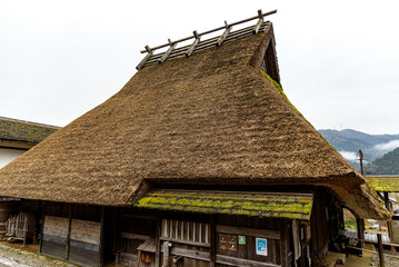 Fototapeta na wymiar Traditional thatched roof houses of Miyama village in Kyoto Prefecture in Japan, made using kayabuki grass roofing technique, a UNESCO Intangible Cultural Heritage on 17 February 2024
