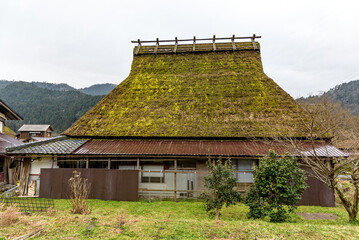 Fototapeta na wymiar Traditional thatched roof houses of Miyama village in Kyoto Prefecture in Japan, made using kayabuki grass roofing technique, a UNESCO Intangible Cultural Heritage on 17 February 2024