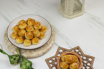 Kue Nastar or Pineapple tart cookies, Indonesian popular cookies during lebaran or hari raya, Eid al fitr and Eid al Adha. Ramadan Islamic theme for text and background.
