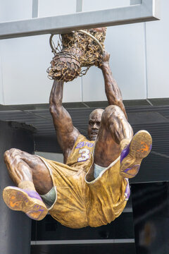 A bronze statue of the LA Lakers basketball player Shaquille O'Neal in front of Crypto.com Arena in Los Angeles California USA