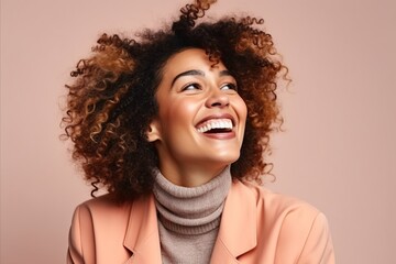 Portrait of a happy young african american woman with curly hair.