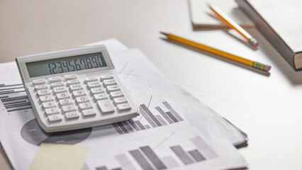 Desk with calculators for calculating, managing and
analyzing economic profits and losses.