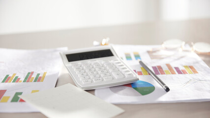 Desk with calculators for calculating, managing and
analyzing economic profits and losses.