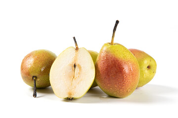 ripe pear fruit with half and slices isolated on white background