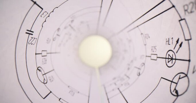 Printed electrical circuit drawings are rolled into a paper tube