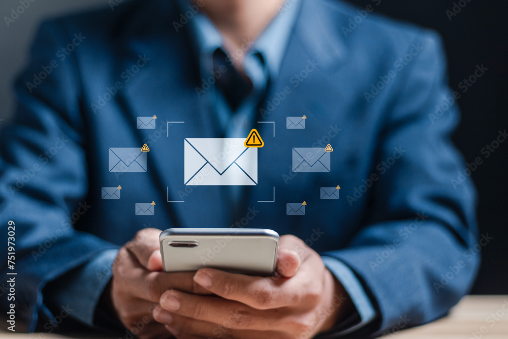 Poster email spam concept. warning notification and spam message. businessman using smartphone with spam em