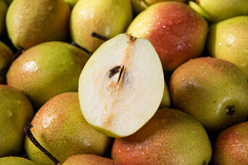fresh ripe pears with half as background