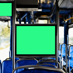 information board in the bus cabin. selective focus. advertising in public transport. screen on the bus, a place for advertising.