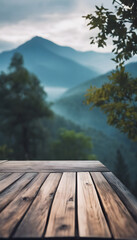 Wooden platform with a scenic view of misty mountains and forest in the background.