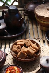 Savory and delicious fried tofu served with garlic chili sauce and petai