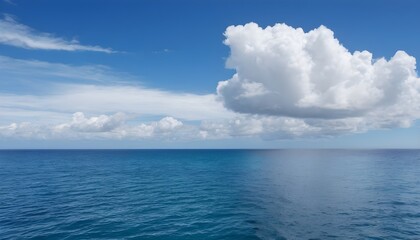 Obraz premium A large body of water with clouds in the sky calm ocean landscape
