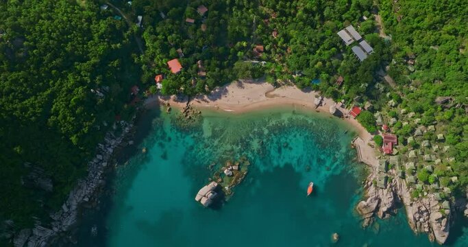 Tilt Up reveal shot of Tanote Bay at Koh Tao island in Thailand