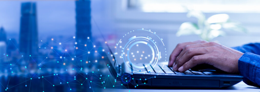 businessman using laptop with internet network digital data and city, connection and communication technology, big data and online marketing concept - Powered by Adobe