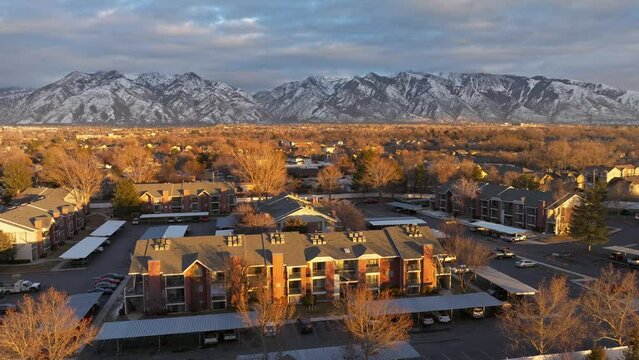 flying over apartments community over Midvale Utah at sunset and Beautiful view from Mountains