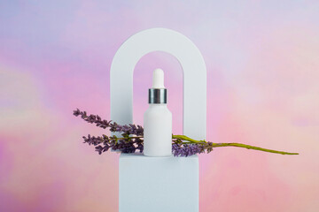 Cosmetic product in tube, bottle, lotion or serum and dried lavender on colorful background. 