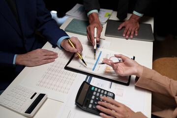 Investment finance concept, group of business people pointing to the graph Business Advisory Meetings and Strategic Brainstorming financial analysis investment and marketing new business project.