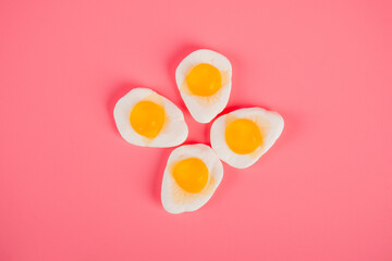 Egg jelly candy isolated on the pink background