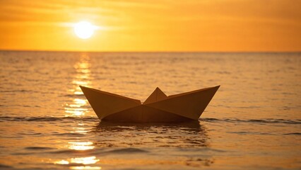 Paper boat sailing on sunset ,at the coean