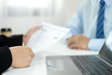 Business people hold a resume and talk to job applicants for job interviews about careers and Their...