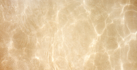 Sun light reflections, water in ocean sand beach background